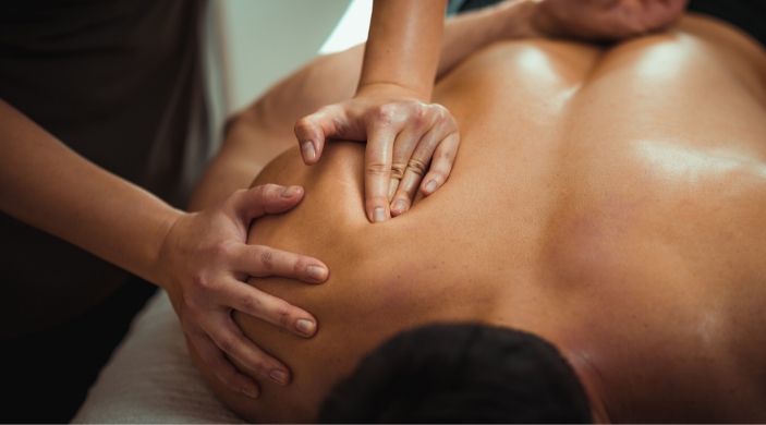 Massage therapist showing the benefits of massage therapy.